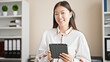 © Krakenimages.com - Young chinese woman business worker using touchpad smiling at office