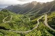 Leinwandbild Motiv Aerial view of green volcanic landscape with mountain road in Tenerife