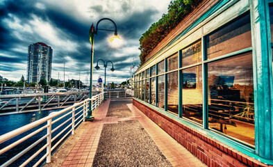 Poster - Nanaimo, Canada. City waterfront at sunset with cloudy sky