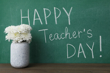 Wall Mural - Happy teacher's day greetings, inscription on a green board