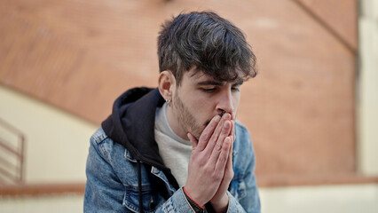 Sticker - Young hispanic man stressed at street