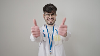 Sticker - Young hispanic man doctor doing thumbs up over isolated white background