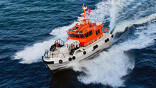 A Coast Guard Boat. Norwegian Sea. View From Open Deck Of Cruise Ship.