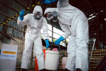 specialist officers in chemical safety wear chemical risk protective clothing for chemical spill cle