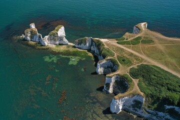 Take in breathtaking Aerial Drone views of the Jurassic coast and unique rock formations on this Old Harry Rocks geological limestone formation