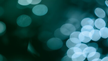 Abstract dark green blue bokeh illustration background and effect overlay. Soft toned vibrant defocused decor template copy space backplate. Macro close-up glow effect product showcase backdrop.