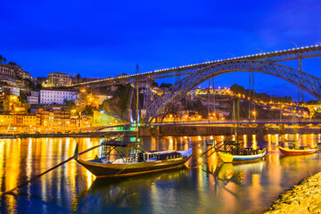 Wall Mural - Porto, Portugal old town skyline on the Douro River with rabelo boats.