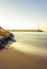 Poster - Dramatic seascape in the port with a lighthouse