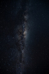 Wall Mural - The Milky Way Galaxy moving over the mountain ridge. Night lapse from night to day. Starry night.