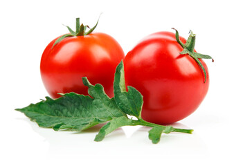 Wall Mural - Red tomatoes with green leaf, isolated on white background