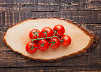 Sticker - Fresh organic tomatoes on wooden board  background. Best for kitchen.