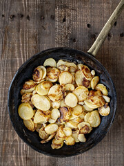 Wall Mural - close up of rustic german bratkartofflen fried potatoes