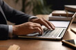 © artpritsadee - Closeup man's hands using laptop. Business communication concept. generative ai.