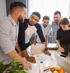 Fototapete - Business partners discussing new business projects and strategies for their companies, enterprises, firms. Creative office workers working round table in office.