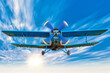 picture of a biplane in the blue sky