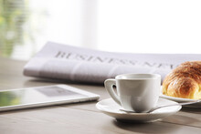 Business Office Scene, Digital Tablet And Newspaper With Coffee