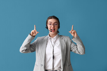 Sticker - Female technical support agent pointing at something on blue background