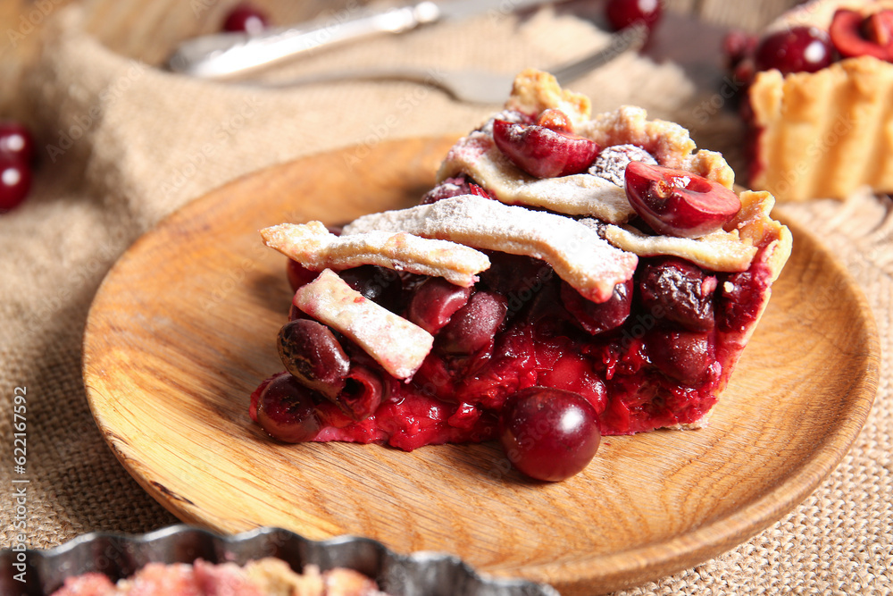 Plate with piece of tasty cherry pie, closeup