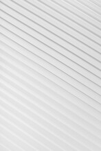 White Abstract Background Of Diagonal Parallel Lines Pattern With Gradient Light, Top View, Backdrop For Advertising, Design, Card, Poster, Flyer, Text, Elegant Soft Futuristic Geometric Style.