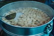Nepalese steamed dumpling momo in a big Steamer pot. Close up image.