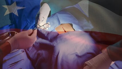 Canvas Print - Animation of flag of chile over diverse surgeons operating