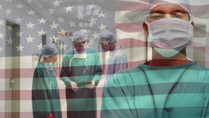 Wall Mural - Animation of american flag over diverse surgeons