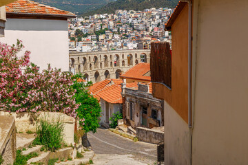 Wall Mural - Ancient aqueduct and cityscape in Kavala, Macedonia, Greece, Europe