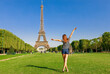 Tourist woman and Eiffel tower in Paris, France, Europe in summer