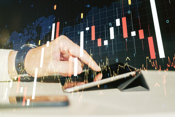Poster - Multi exposure of abstract financial graph with world map and hand working with a digital tablet on background, financial and trading concept