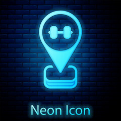 Canvas Print - Glowing neon Location gym icon isolated on brick wall background. Vector