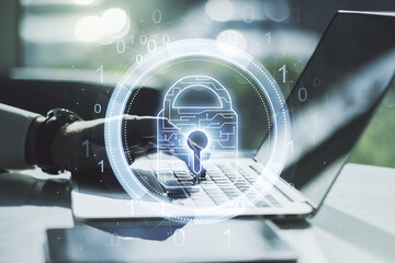 Aufkleber - Double exposure of creative lock hologram with chip and hands typing on laptop on background. Information security concept