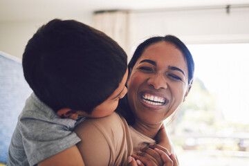 Wall Mural - Funny, mother and hug child in home, bonding and having fun together. Happy, mom and embrace kid, laughing and smile with care, love and affection, play and enjoying quality time to relax with family