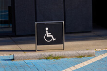 Handicap sign on black board. This is parking lot for reserve for person who use wheelchair.