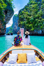 Luxury Longtail Boat In Krabi Thailand, Couple Man, And Woman On A Trip To The Tropical Island 4 Island Trip In Krabi Thailand. Asian Woman And European Man Mid Age On Vacation In Thailand.