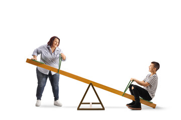 Poster - Mother playing with son on a seesaw