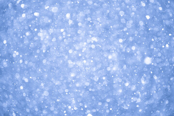 Sticker - Abstract Blue Christmas Background with Real Snow. Blurred Snowflakes Photo.