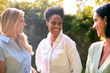 © Monkey Business - Three Smiling Mature Female Friends Outdoors Spending Time In Countryside Together