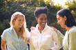 © Monkey Business - Three Smiling Mature Female Friends Outdoors Spending Time In Countryside Together