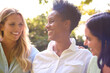 © Monkey Business - Three Smiling Mature Female Friends Outdoors Spending Time In Countryside Together