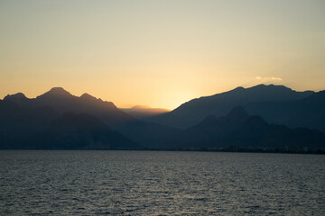 Wall Mural - Mountain, sea and sunset views. Beautiful nature, enjoyment, relaxation, sense of tranquility.