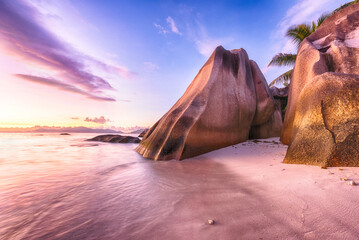 Poster - Beautifully shaped granite boulders and a dramatic sunset  at Anse Source d'Argent beach, La Digue island, Seychelles