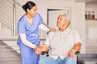 © Theron/peopleimages.com - Happy woman, nurse and talking to patient in wheelchair for support, medical service and physical therapy in retirement home. Caregiver helping elderly person with disability, healthcare and nursing
