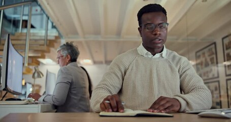 Poster - Writing, notebook and research with a business black man at his desk in the office for planning a strategy. Computer, information and reading with a young employee working on an agenda at night