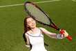 © Богдан Маліцький - girl tennis player in white sports uniform with tennis racket sits and rests on green court, woman coach smiles