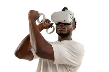 african american man in white t-shirt in virtual reality glasses holds joysticks on white isolated background