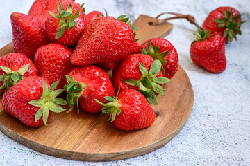 Wall Mural - Fresh organic red    Strawberryes on wooden background. Summer dessert