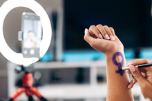 Woman Drawing Herself The Sign Of Venus. Venus Sign On The Skin. Feminist Influencer