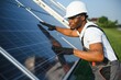 © Serhii - Portrait of african american electrician engineer in safety helmet and uniform installing solar panels.