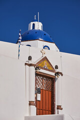 Wall Mural - Small Church with its Blue Dome - Imerovigli - Santorini Island, Greece - Beautiful Blue Sky