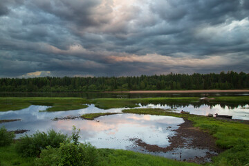 Wall Mural - summer landscape with thunderclouds.background of the summer sky with thunderclouds.